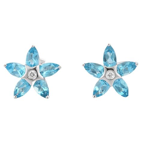 Floral Ct Sky Blue Topaz Stud Earrings With Diamonds In K White