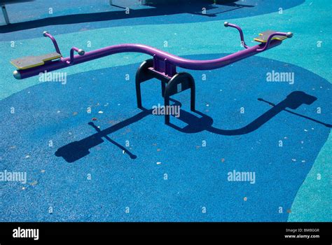 See saw at a children's playground Stock Photo - Alamy