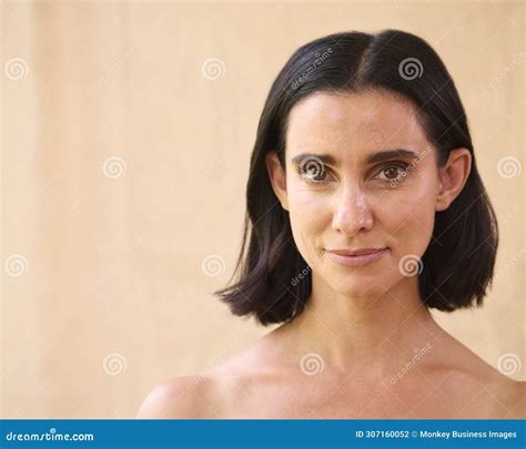 Beauty Portrait Of Smiling Mature Woman With Bare Shoulders Against Natural Background Stock
