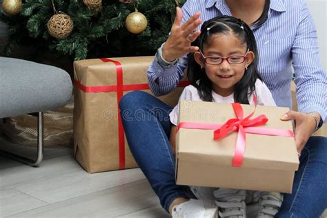 Divorced Single Mom And Daughter Latina Brunettes With Glasses Have Christmas Presents Sitting
