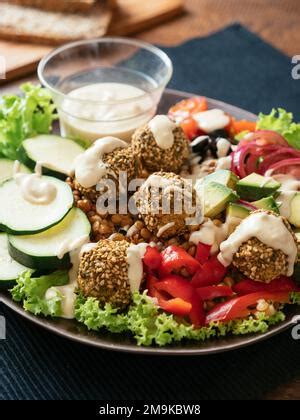 Falafel Salad With Avocado Tomato And Tahini Dressing Top View