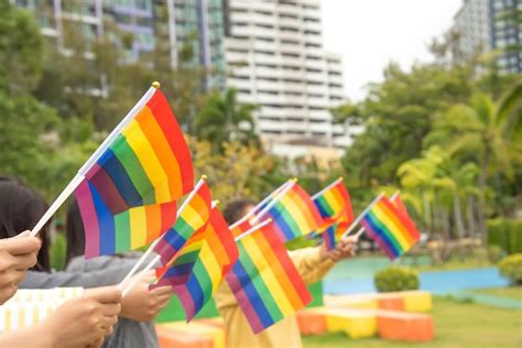 Premium Photo Diversity People Hands Raising Colorful Lgbtq Rainbow Flags Together A Symbol