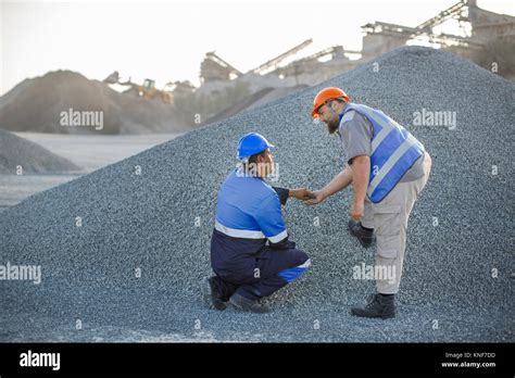 quarry workers  quarry checking aggregate stock photo alamy