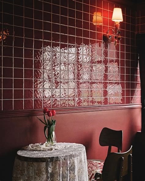 Premium Photo | Vertical shot of a red cafe interior with tiled walls