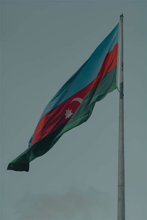 Azerbaijani Flag on Flagpole · Free Stock Photo