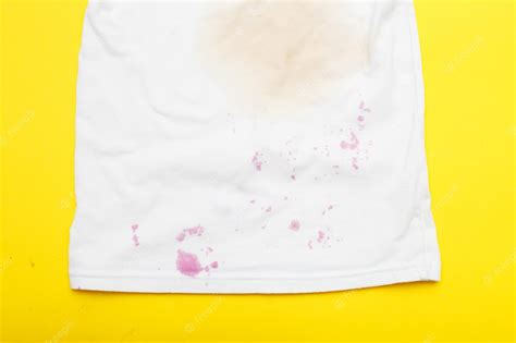 Premium Photo | Dirty stains on a white Tshirt from berries and drink ...