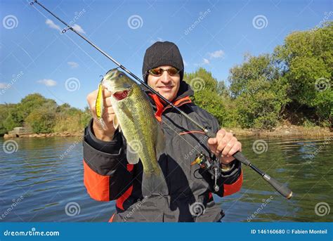 Man Holding Bass Fishing Scene Catch Of Fish Stock Photo Image Of