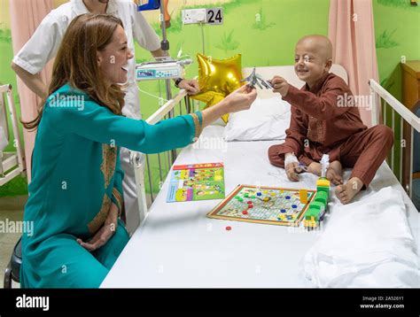 The Duchess Of Cambridge Plays With Toy Aeroplanes With An Unnamed