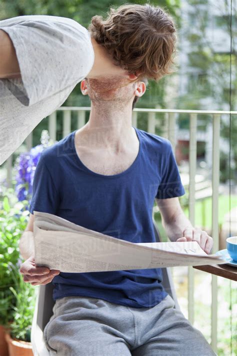 Gay Couple Kissing At Porch Stock Photo Dissolve