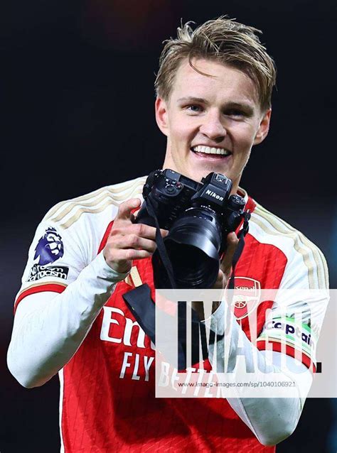 Martin Odegaard Of Arsenal Takes A Camera In His Hands After The Match