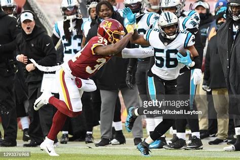 Jermaine Carter Of The Carolina Panthers Is Pushed Out Of Bounds By