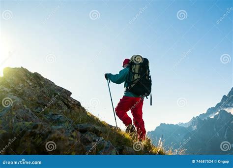 Man hiking in mountains stock photo. Image of trekking - 74687524