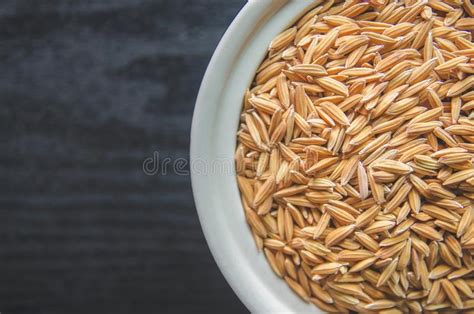 Fondo Y Papel Pintado Por La Pila De Arroz De Arroz Y De Semilla Del