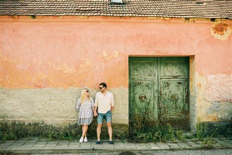 Woman and Man Holding Hands by Door of Building · Free Stock Photo