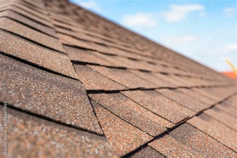 Asphalt tile roof on new home under construction Stock Photo | Adobe Stock