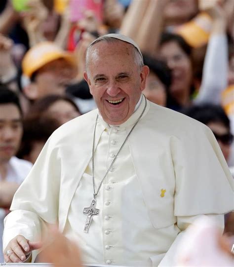 The Pope Smiles As He Walks In Front Of A Crowd