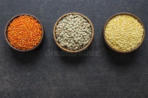 Green Lentils In Wooden Spoon Or Shovel On Wooden Background Stock