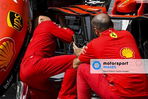 Ferrari Mechanics With The Front Wing Of Ferrari Sf90 Hungarian Gp