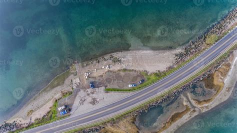 Aerial photo of roads on small island with cars driving 5097922 Stock Photo at Vecteezy