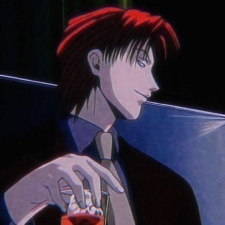 A Man With Red Hair Holding A Drink In His Hand