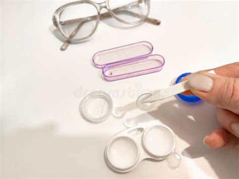 A Set For Contact Lenses With A Container Forceps Glasses The