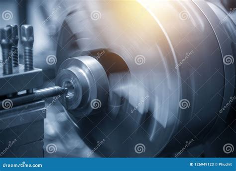 The Operation Of Lathe Machine Cutting The Steel Shaft Stock Image