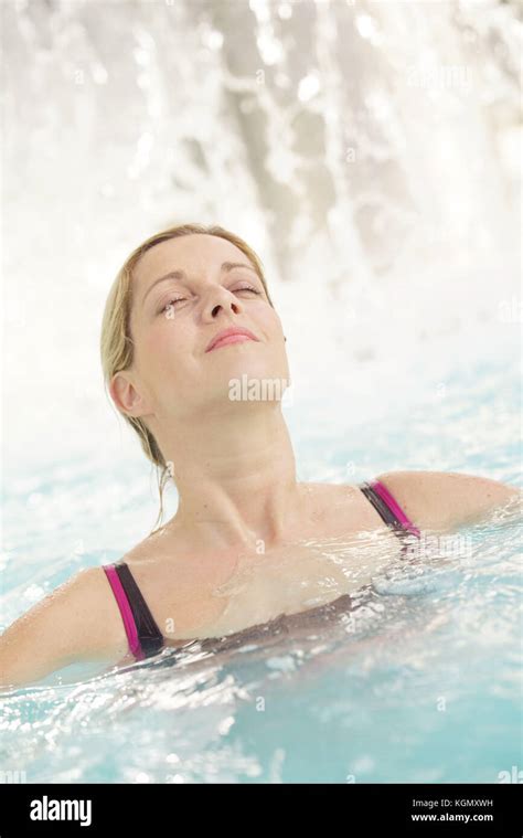 Attractive Blond Woman Relaxing In Spa Pool Stock Photo Alamy