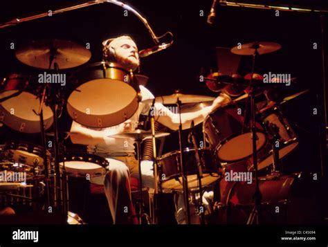 Phil Collins in performance with the progressive rock band Genesis, 1975 Stock Photo - Alamy