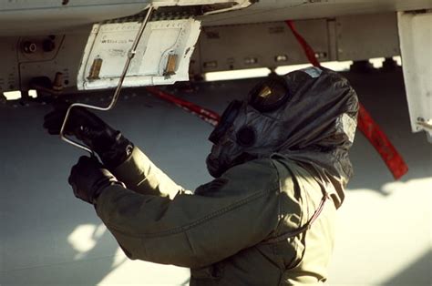 A Ground Crewman Services A Rd Tactical Fighter Wing Aircraft During