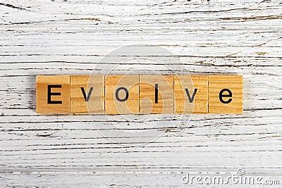 Evolve Word Made With Wooden Blocks Concept Stock Photo Cartoondealer