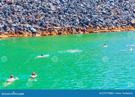 Holidaymakers In The Hot Springs Of Nea Kamen Volcanic Island Santorini