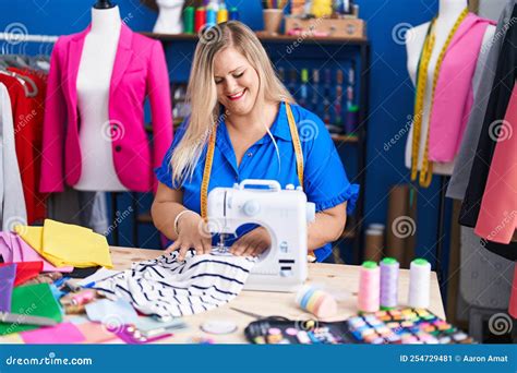 Young Woman Tailor Smiling Confident Using Sewing Machine At Sewing