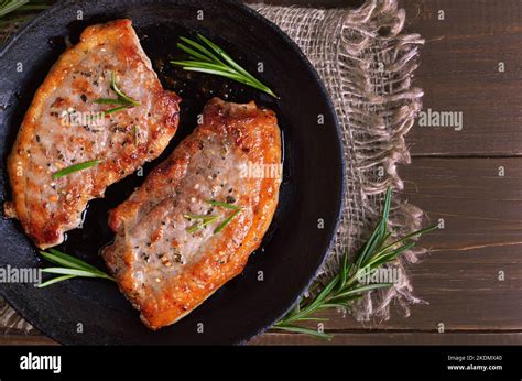 Roasted Pork Steaks On Wooden Background Top View Top View Flat Lay