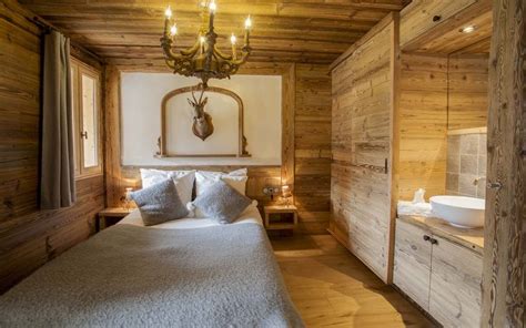 A Bed In A Room With Wooden Walls