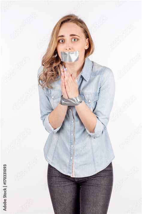 Portrait Young Woman Tied Up With Duct Tape Covering Mouth And Hands