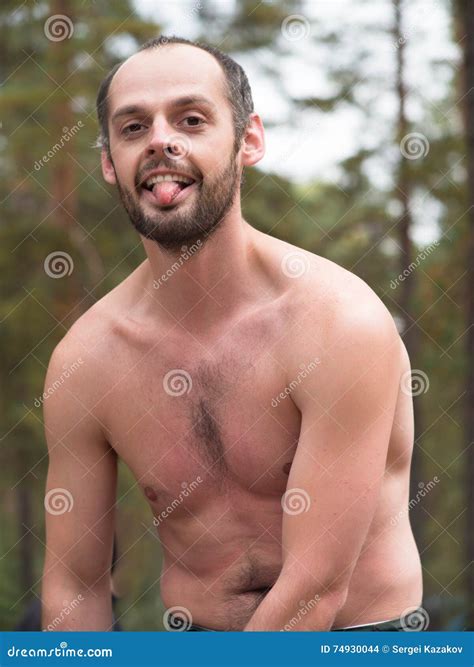 Man With Naked Torso Showing Tongue Stock Photo Image Of Looking Playful 74930044