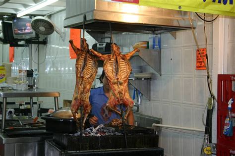 Cabrito One Of The Main Local Dishes Slowly Cooked For Hours Over