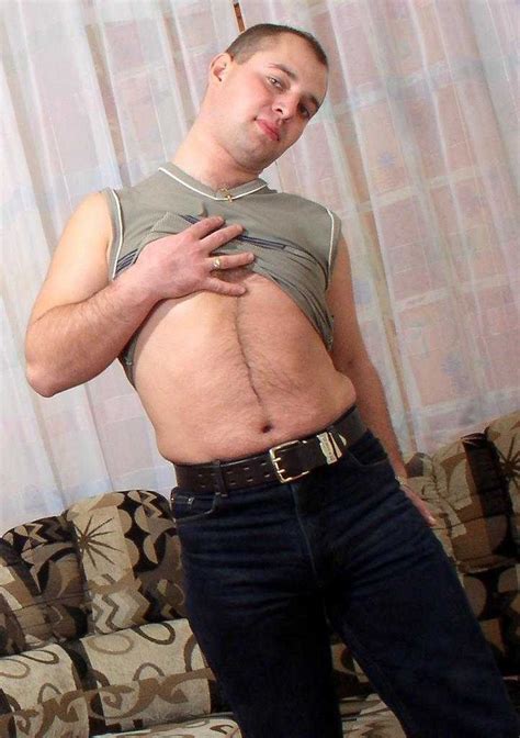 Horny Naked Gay Bear Enjoys Teasing And Posing On A Sofa Porn Pictures XXX Photos Sex Images