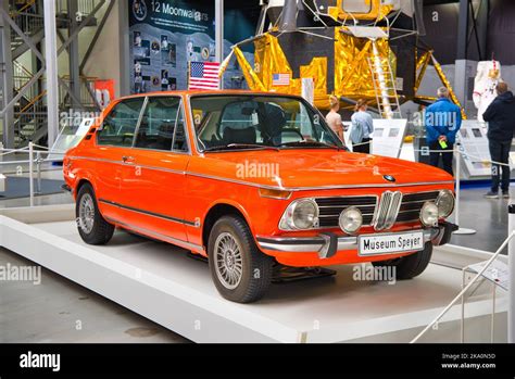 SPEYER, GERMANY - OCTOBER 2022: orange BMW 2002tii 02 2 series 1966 retro car in the ...