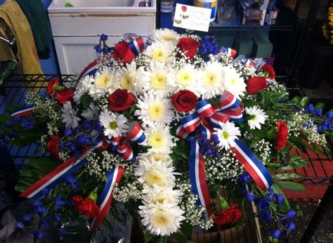 Patriotic cross casket spray | Funeral floral arrangements, Casket ...