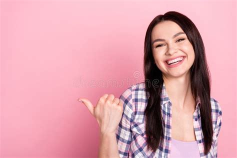 Photo Of Shiny Excited Young Lady Dressed Checkered Shirt Pointing Thumb Up Empty Space Smiling