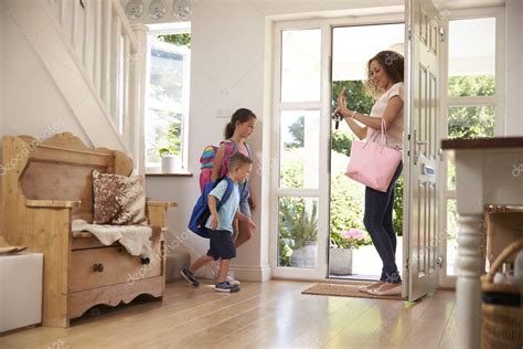 Children And Mother Near Door Of Hall — Stock Photo © Monkeybusiness