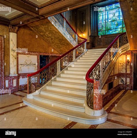 Marble Stairway Leading Toward Tiffany Stained Glass Window At