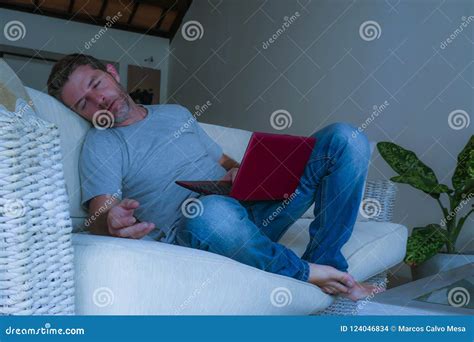 Lifestyle Indoors Portrait Of Young Attractive Tired And Exhausted Man