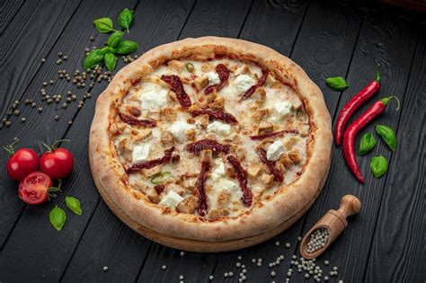 Big And Tasty Pizza With Sun Dried Tomatoes And Feta Cheese Stock Image