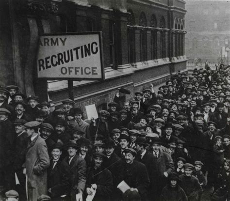 An Old Black And White Photo Of Many People In Front Of A Building With