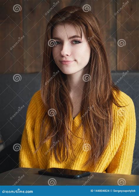 Portrait Of A Cute Pretty Redhead Woman With Unimpressed Face