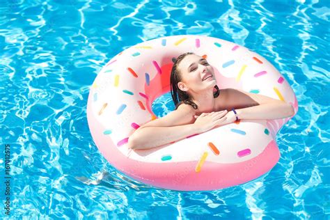 Young Caucasian White Beautiful Woman Relaxing In Swimming Pool Sexy