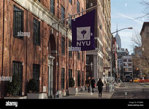 New York University buildings with the purple NYU logo flag hanging ...