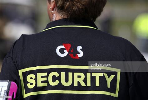 The G4s Plc Company Logo Sits On The Back Of A Security Guards News